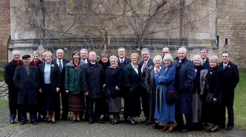 CES Missionaries in Hildesheim in front of the thousand -year-old Rosebush